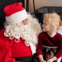 Little girl stares at Santa